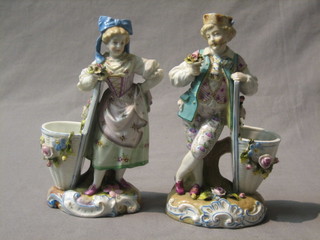 A pair of 19th Century Continental porcelain figures of a standing lady with basket ware panier 7" (1 f and r)