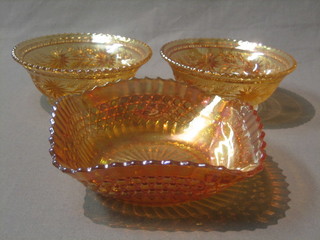 An orange Carnival glass square dish 6 1/2" and 2 circular orange Carnival glass bowls 6"