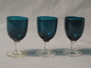 3 19th/20th Century green glass wine glasses with clear glass stems