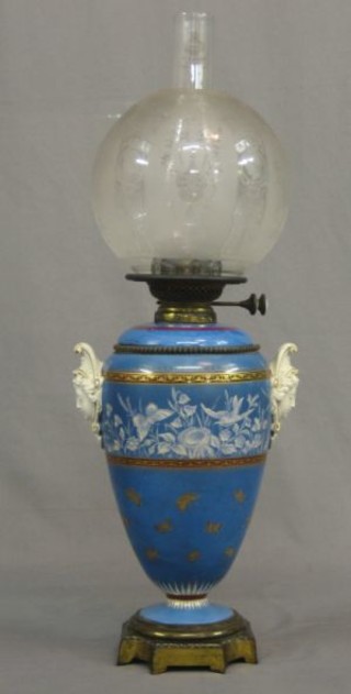 An  impressive Minton style blue glazed pottery twin handled oil lamp base  decorated flowers and butterflies, with detachable reservoir, having an etched clear glass shade and raised on a square foot 23" 