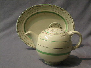 A Clarice Cliff circular pottery teapot, matching meat plate and 2 other meat plates
