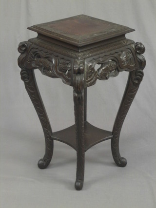 A square Eastern pierced hardwood 2 tier jardiniere stand raised on cabriole supports 14"