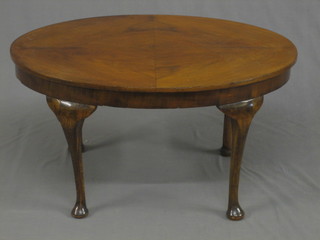 An Art Deco oval walnut occasional table, raised on cabriole supports 29"
