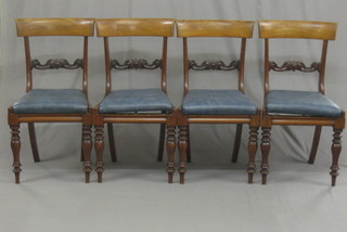 A set of 4 19th Century mahogany bar back dining chairs with carved mid rails and upholstered drop in seats, raised on turned supports