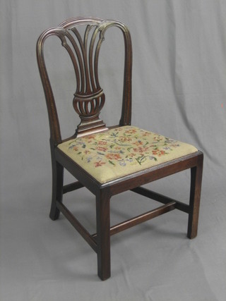A 19th Century mahogany Hepplewhite style dining chair with upholstered Berlin wool work seat, raised on square supports united by an H framed stretcher