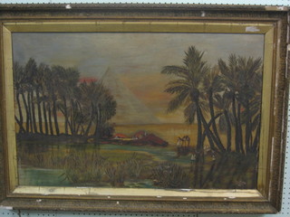 An oil on canvas, Egyptian School "Pyramids with Oasis and Figures" 21" x 32"
