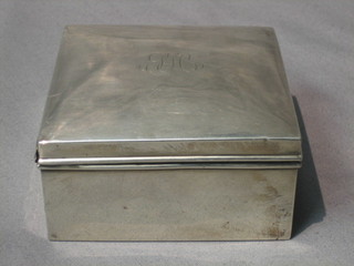 A silver cigarette box with hinged lid, Birmingham 1924, 4" (marks rubbed)