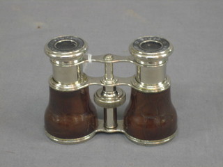 A pair of 19th/20th Century chromium plated opera glasses marked Lemaire Paris