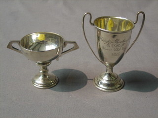 2 small silver trophy cups and a silver napkin ring