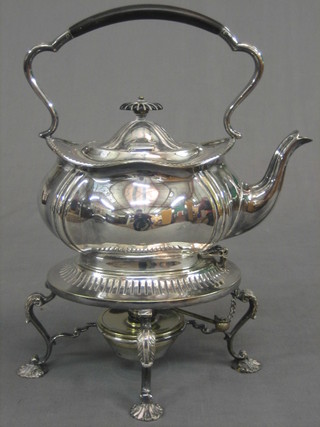 A silver plated spirit kettle complete with burner
