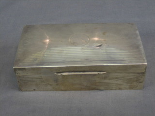 A silver cigarette box with engine turned decoration, Birmingham 1932, 6"