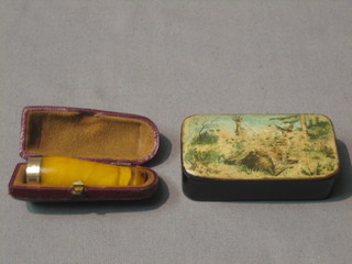 An amber and gold mounted cigar holder