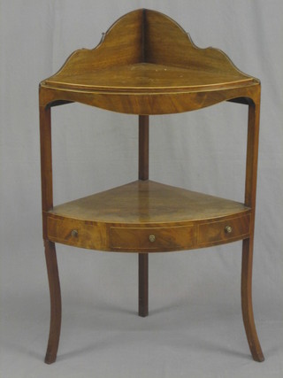 A 19th Century mahogany corner wash stand with raised gallery to the back, the base with undertier and fitted 1 long drawer, raised on splayed feet 24"