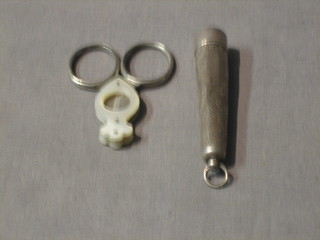 A silver cigarette holder with amber mouthpiece and matching case, Birmingham 1913 and a cigar cutter
