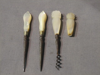 A Victorian steel scent bottle cork screw with carved mother of pearl handle and 2 other mother of pearl handled implements and 1 other m.o.p handle