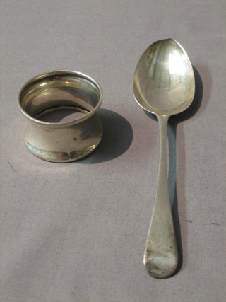A George III silver fiddle pattern spoon, London 1831 and a waisted silver napkin ring
