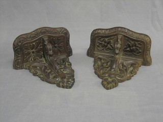 A pair of Victorian heavily carved oak wall brackets 12"