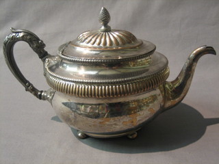 A Georgian oval silver plated teapot raised on bun feet the base marked SMG