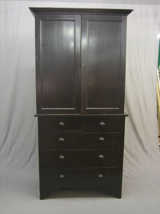 A 19th Century black painted pine press cabinet, the upper section with moulded cornice, the interior fitted shelves enclosed by panelled doors, the base fitted 2 short and 3 long graduated drawers with tore handles 36"