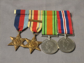 A group of 4 medals comprising 1939-45 Star, Africa Star with bar 8th Army, Defence and War medal