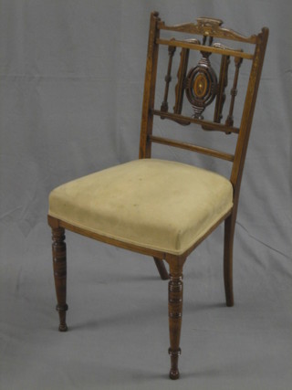 An Edwardian inlaid mahogany bedroom chair with upholstered seat, raised on turned supports