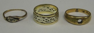 A lady's 2 coloured "gold" wedding band, an 18ct gold illusion set dress ring and a gold gypsy ring (no stone)