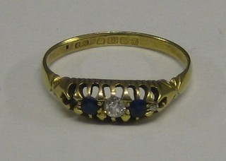 A lady's 18ct gold dress ring set a diamond and 2 sapphires