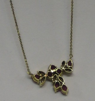 A gold pendant set ruby and diamond