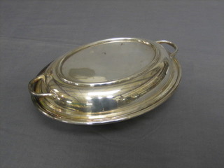 A twin handled silver plated entree dish and cover