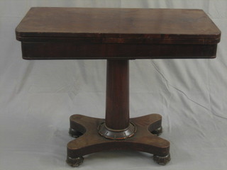 A William IV mahogany D shaped card table, raised on a turned column and platform base 36"