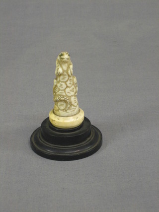An Oriental carved ivory figure of a lizard 2 1/2", raised on a socle base