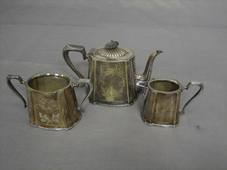 A Victorian engraved Britannia metal 3 piece tea service of oval form comprising teapot, twin handled sugar bowl and cream jug