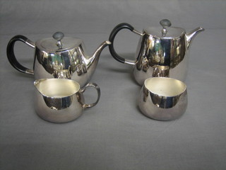 An Art Deco 4 piece silver plated tea service comprising oval teapot, hotwater jug, sugar bowl and cream jug