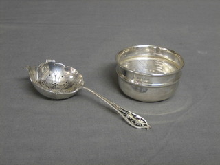 A silver tea strainer and stand, Sheffield 1933