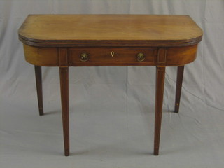 A Georgian mahogany D shaped tea table, the base fitted a drawer with ivory escutcheon and brass drop handles, raised on square tapering supports 40"