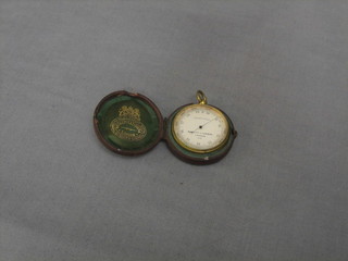 A pocket barometer by Negretti & Zamba, the reverse engraved Presented to Mr John Oliver Scott by The Staff on Lord Falmouth, Cornish Estate, as a mark of their respect of his resigning his appointment in the Tregothman Office Truro, 10 October 1882, contained in a leather case