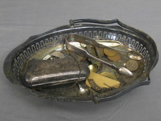 A lady's silver plated evening purse, a silver plated cake basket with swing handle etc