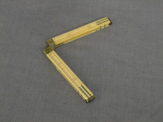 An ivory and polished steel 12" folding gauge