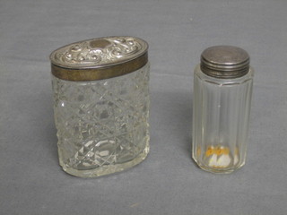 A cylindrical cut glass pin jar with silver lid 3" together with an oval ditto 3 1/2"