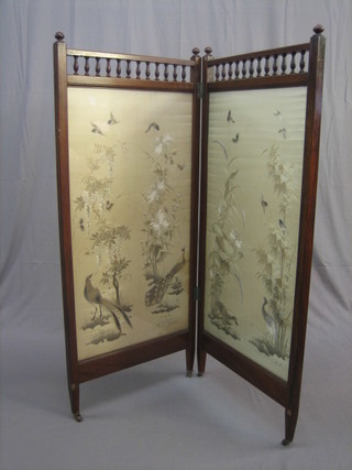 An Edwardian walnut 2 fold draft screen with bobbin turned decoration having embroidered panel depicting birds in branches 57"