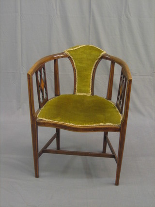 An Edwardian inlaid mahogany tub back chair raised on square tapering supports with H framed stretcher