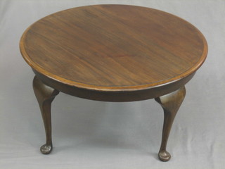A circular mahogany occasional table, raised on cabriole supports 27"