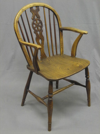 A 19th/20th Century elm stick and wheel back kitchen carver chair 