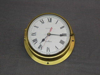 A quartz wardroom style clock contained in a "brass" case by Westclox 8"