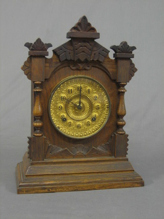 A Victorian American 8 day striking shelf clock with porcelain dial contained in a carved oak frame