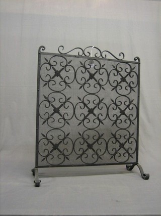 A blacksmith's made wrought iron and mesh spark guard 23 1/2" x 26"