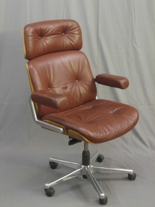 A 1960's chromium plated and brown hide Emes style revolving office chair