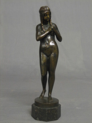 Brems, an Art Deco bronze figure of a standing Indian girl, raised on an octagonal marble base 11"
