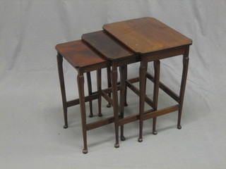 A nest of 3 1930's mahogany interfitting coffee tables, raised on cabriole supports 17 1/2"