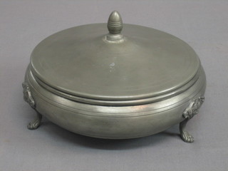A circular pewter jar and cover raised on hoof feet 7"